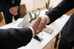 Business handshake representing strategic partnerships